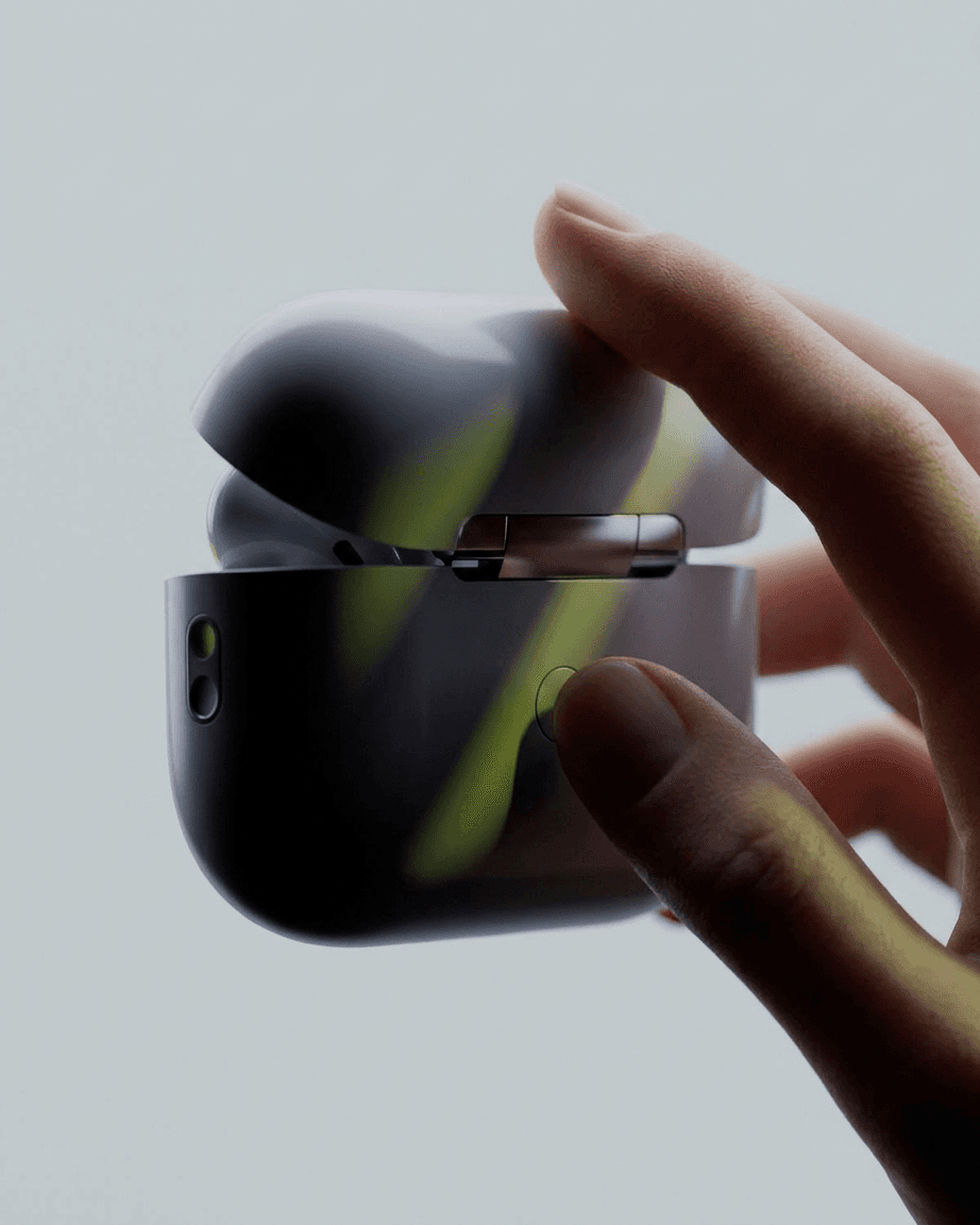 Hand holding an open wireless earbud case with a minimalistic background.