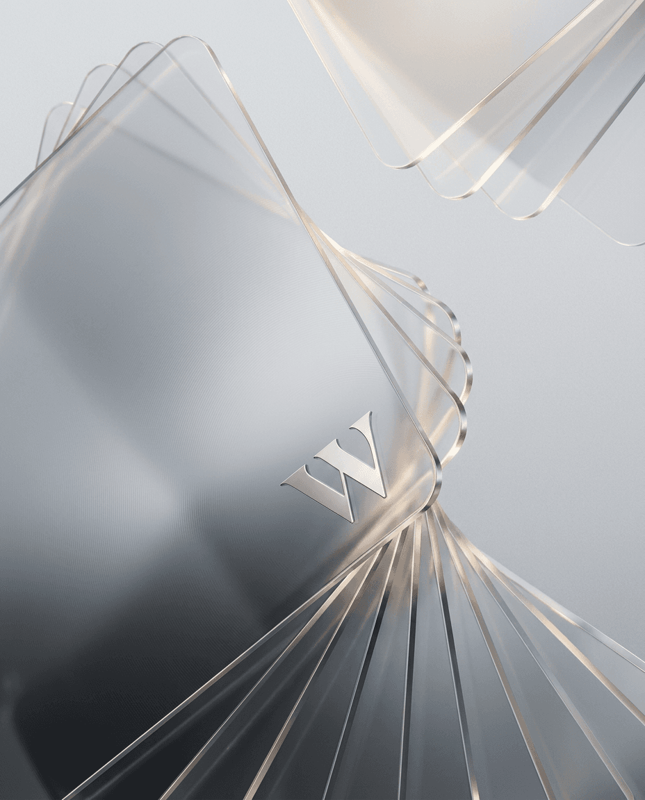 Close-up of layered translucent cards in soft gray and clear tones.