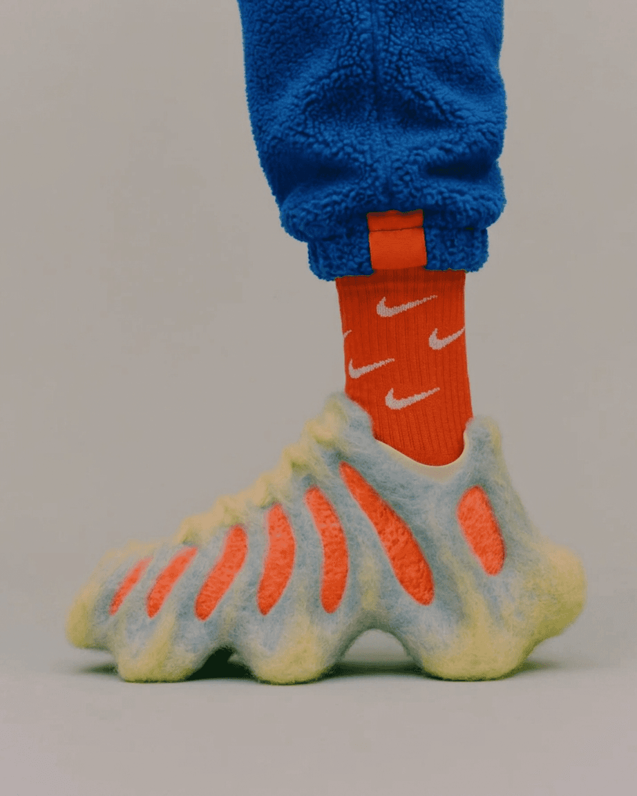 Close-up of a textured sneaker worn by a person in vibrant colours.