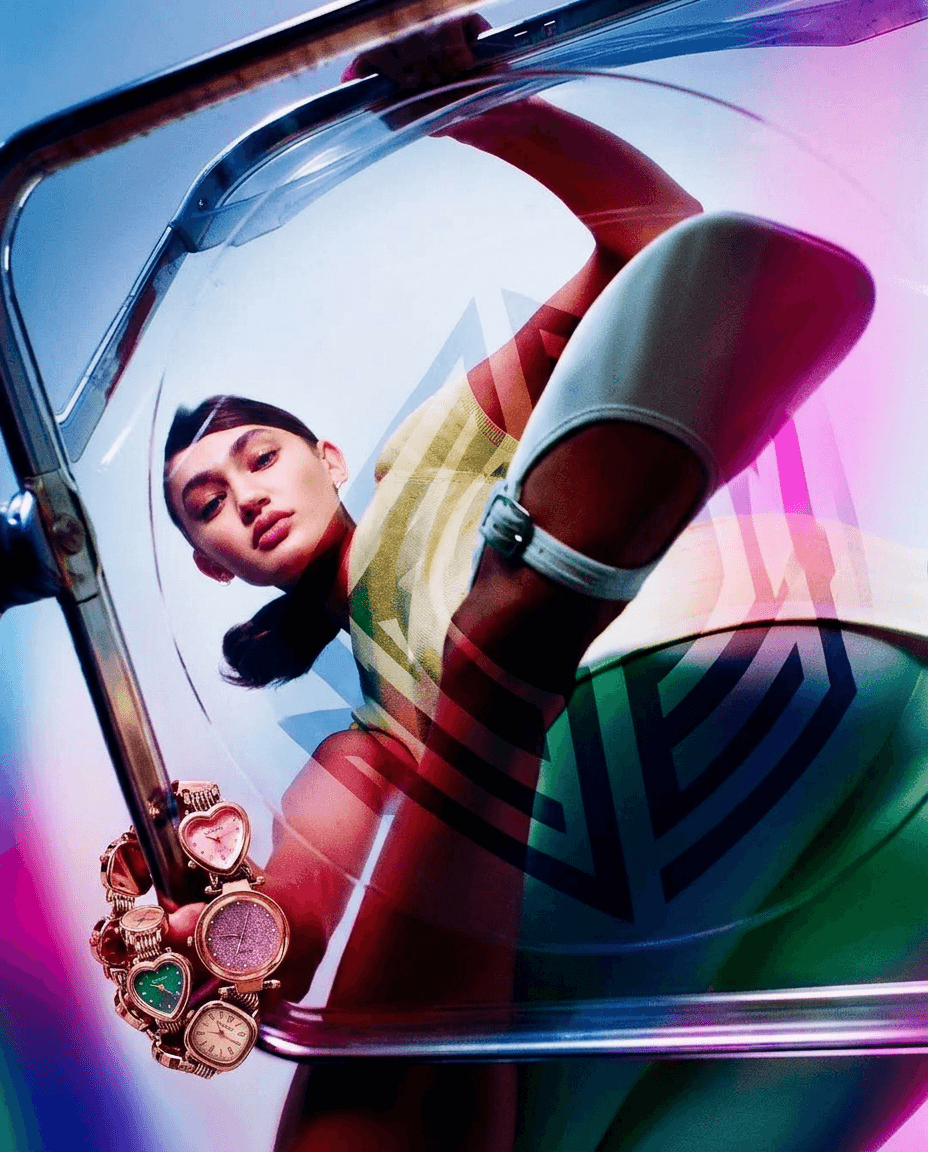 Model seen from below through a transparent dome, featuring pink, green, and blue hues.