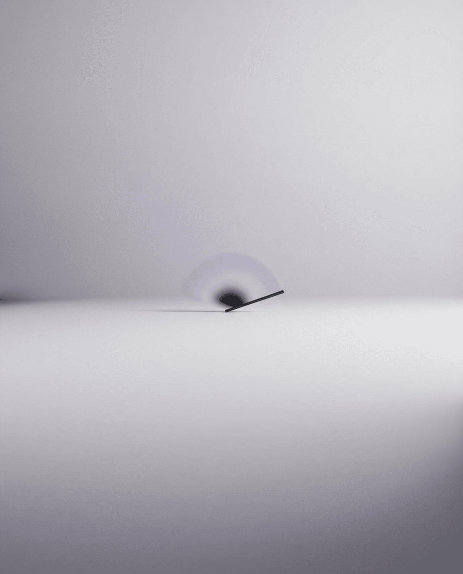 A delicate blade balancing on a smooth surface with soft grey and white gradients.