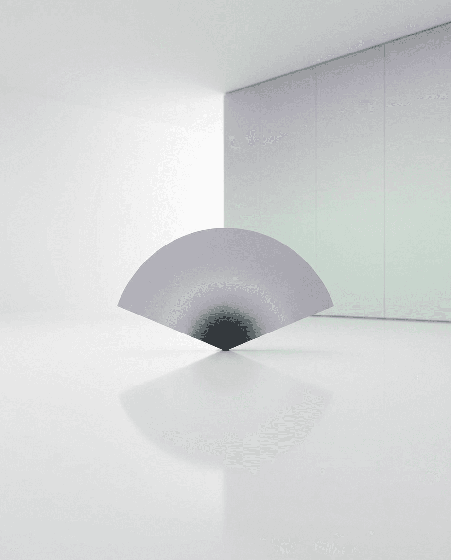 A large curved shape on a smooth reflective surface in a white space.