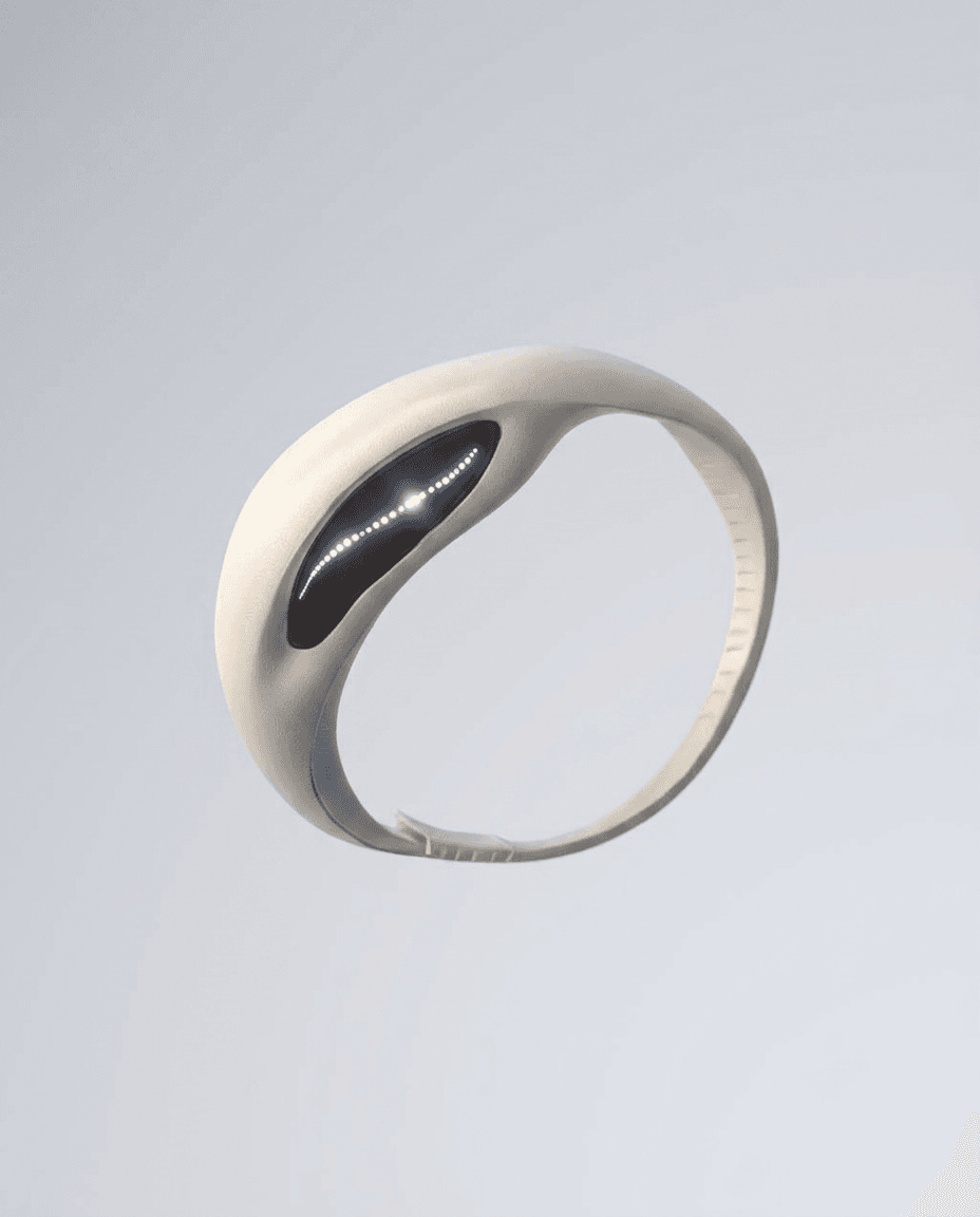 A sleek, white wearable device with a dark display on a neutral background.