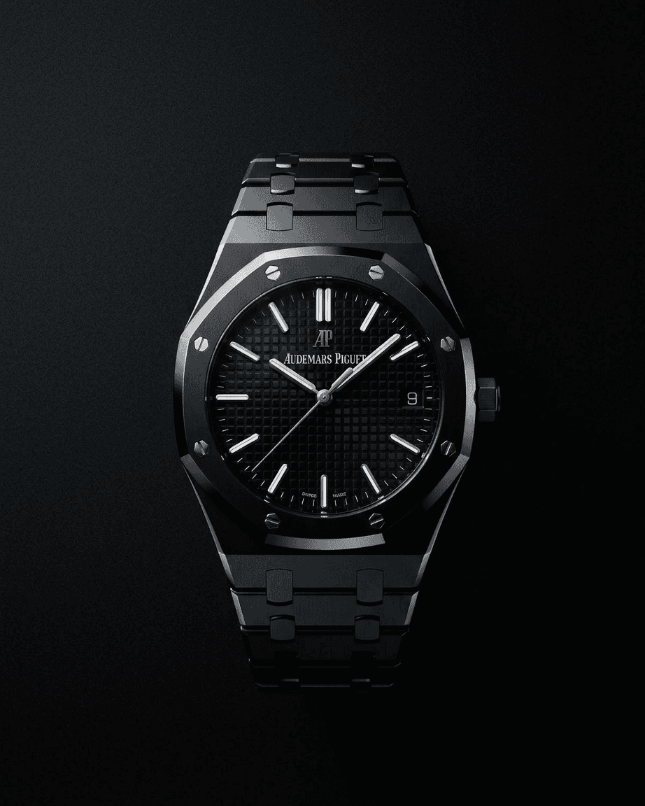 Black Audemars Piguet watch on a dark background, showcasing its elegant design.