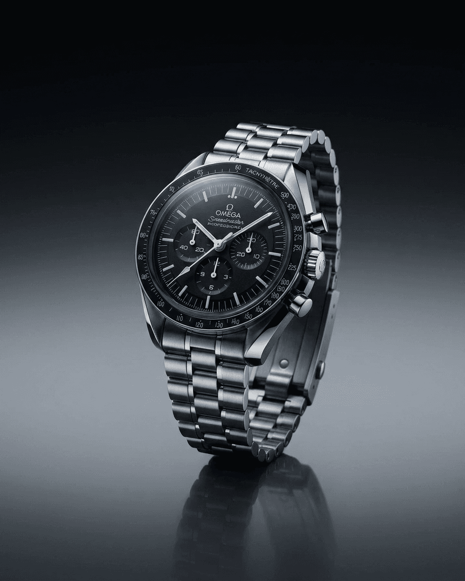 Omega watch showcased on a dark surface, highlighting its metallic silver details.