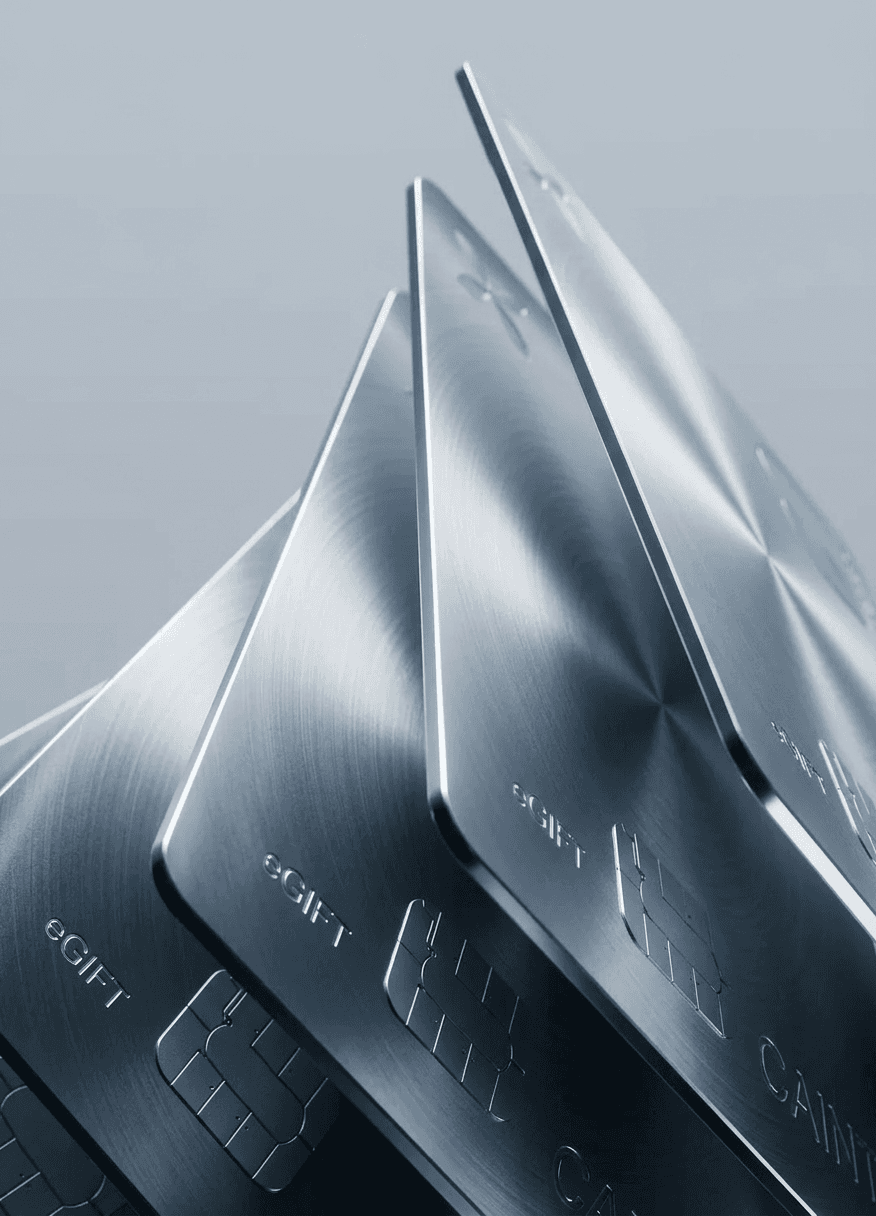 Stack of metallic gift cards at an angle, highlighting smooth surfaces.