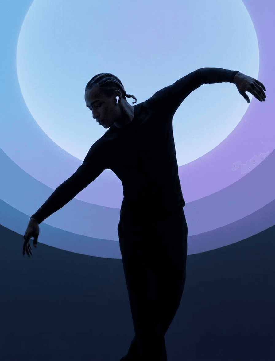 Silhouette of a dancer in a pose against a purple and blue gradient background.