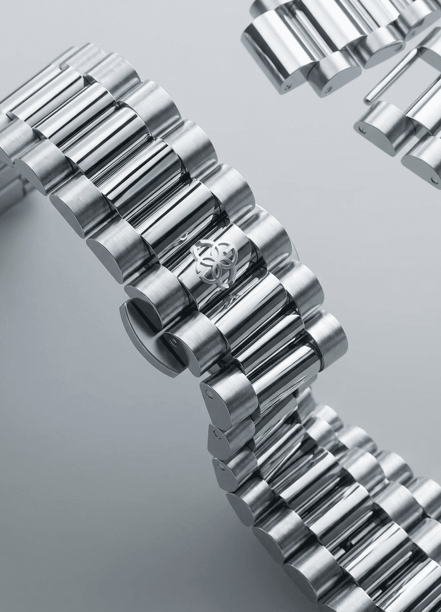 A metallic watch bracelet with intricate design on a minimalist background.