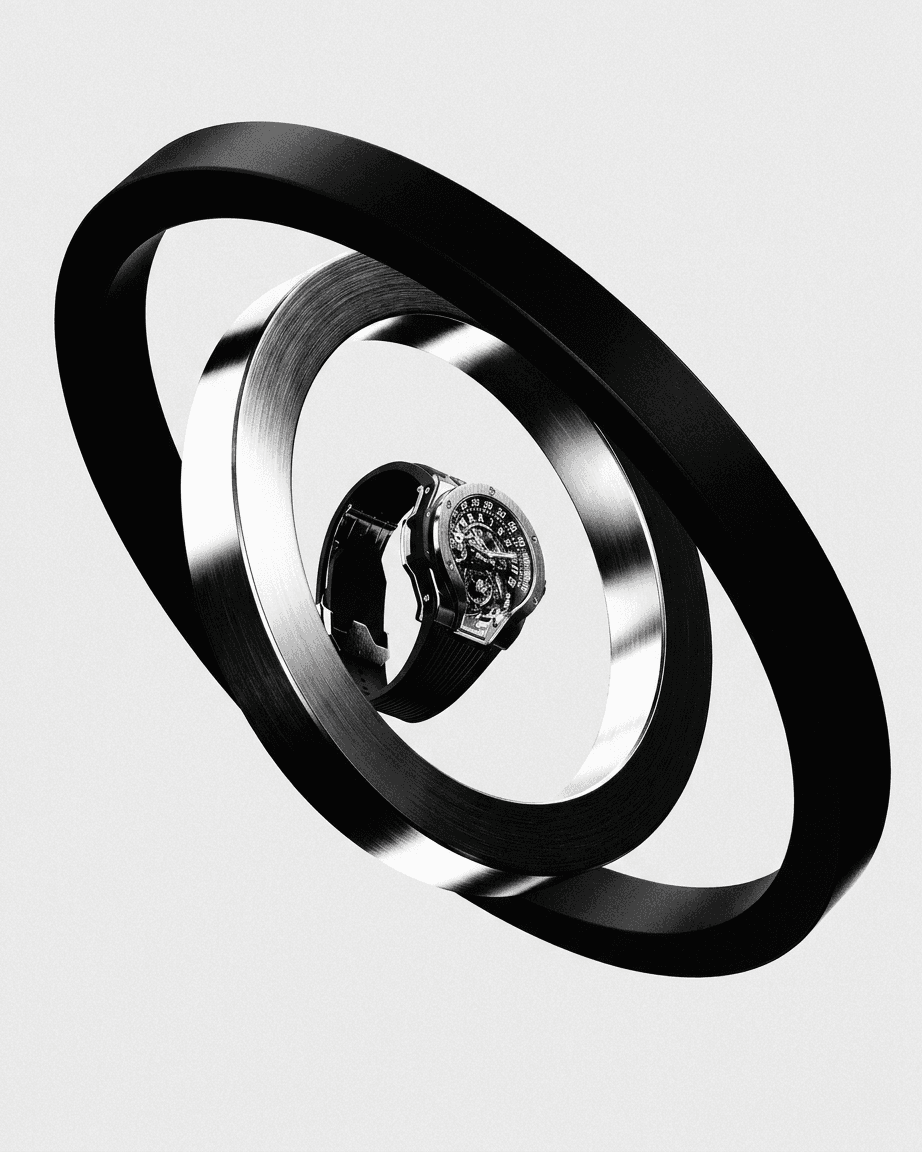 A sleek silver watch suspended between two black rings.