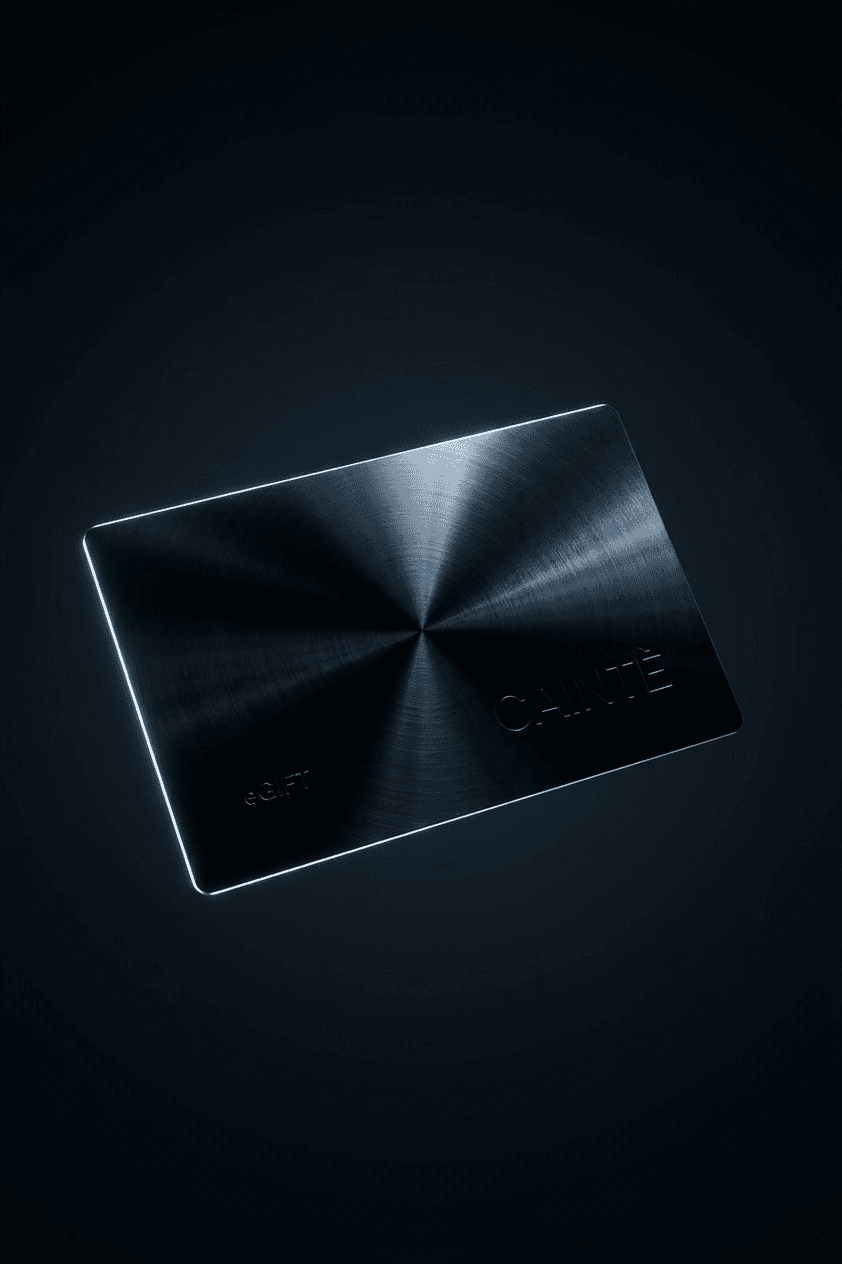 Metallic gift card with a brushed finish on a dark background.