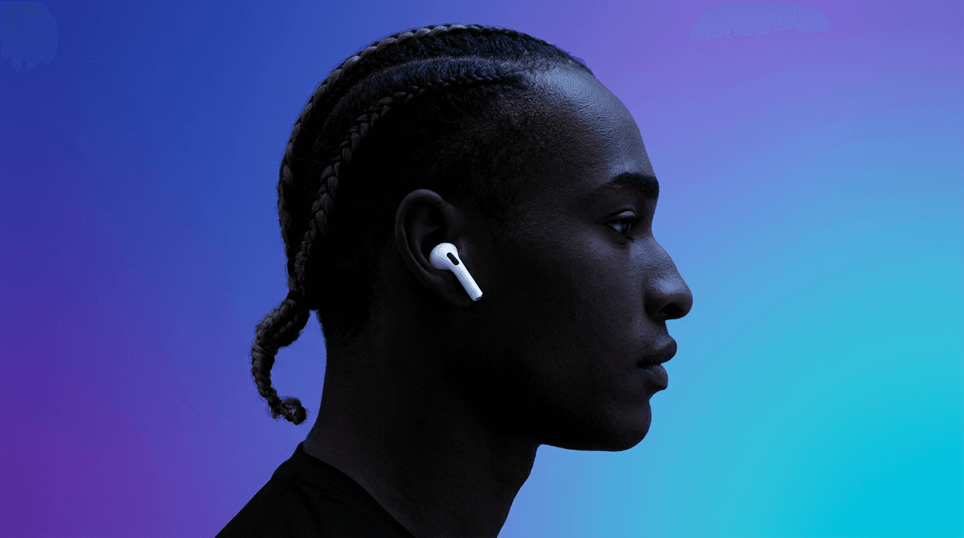 Profile portrait of a person wearing AirPods with a purple and turquoise gradient backdrop.