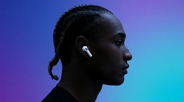 Profile portrait of a person wearing AirPods with a purple and turquoise gradient backdrop.