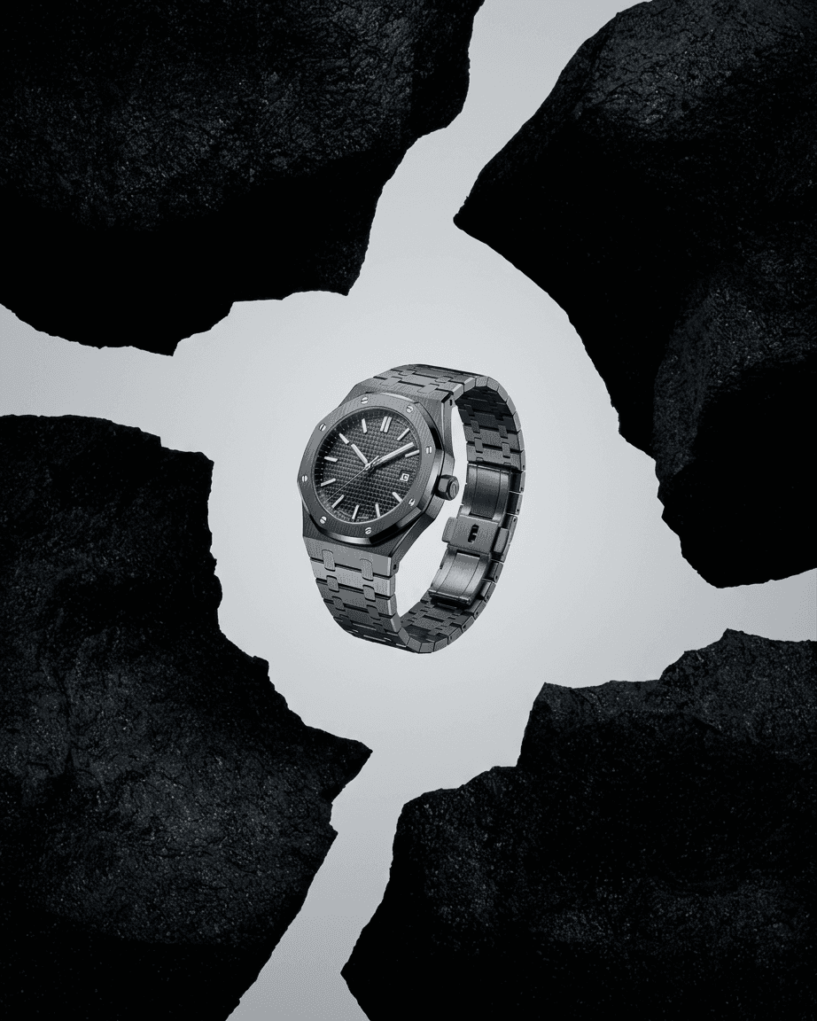 A black watch displayed on cracked dark rocks.