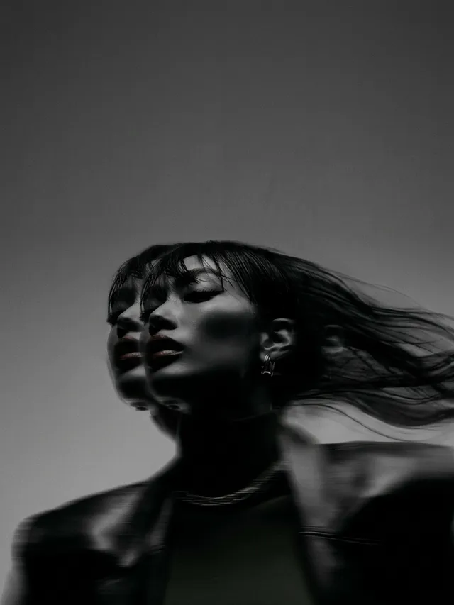A model in a blurred double exposure effect, conveying motion and intensity.